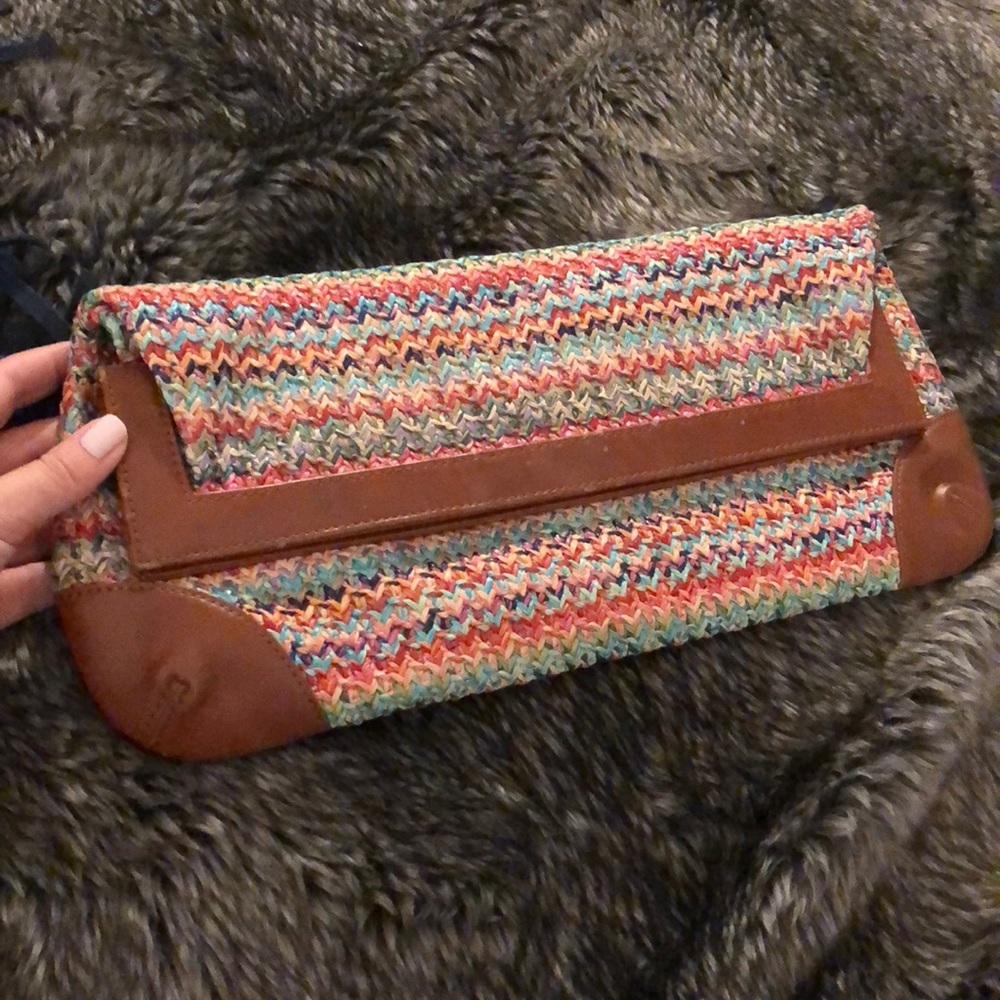 Amazing colored weaved clutch with leather detail